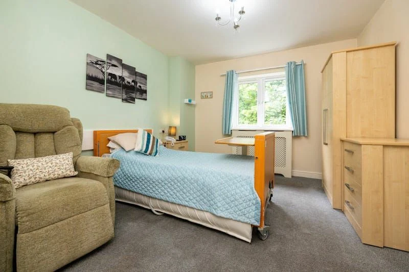 Littleover Nursing Home bedroom — warm, homely interior